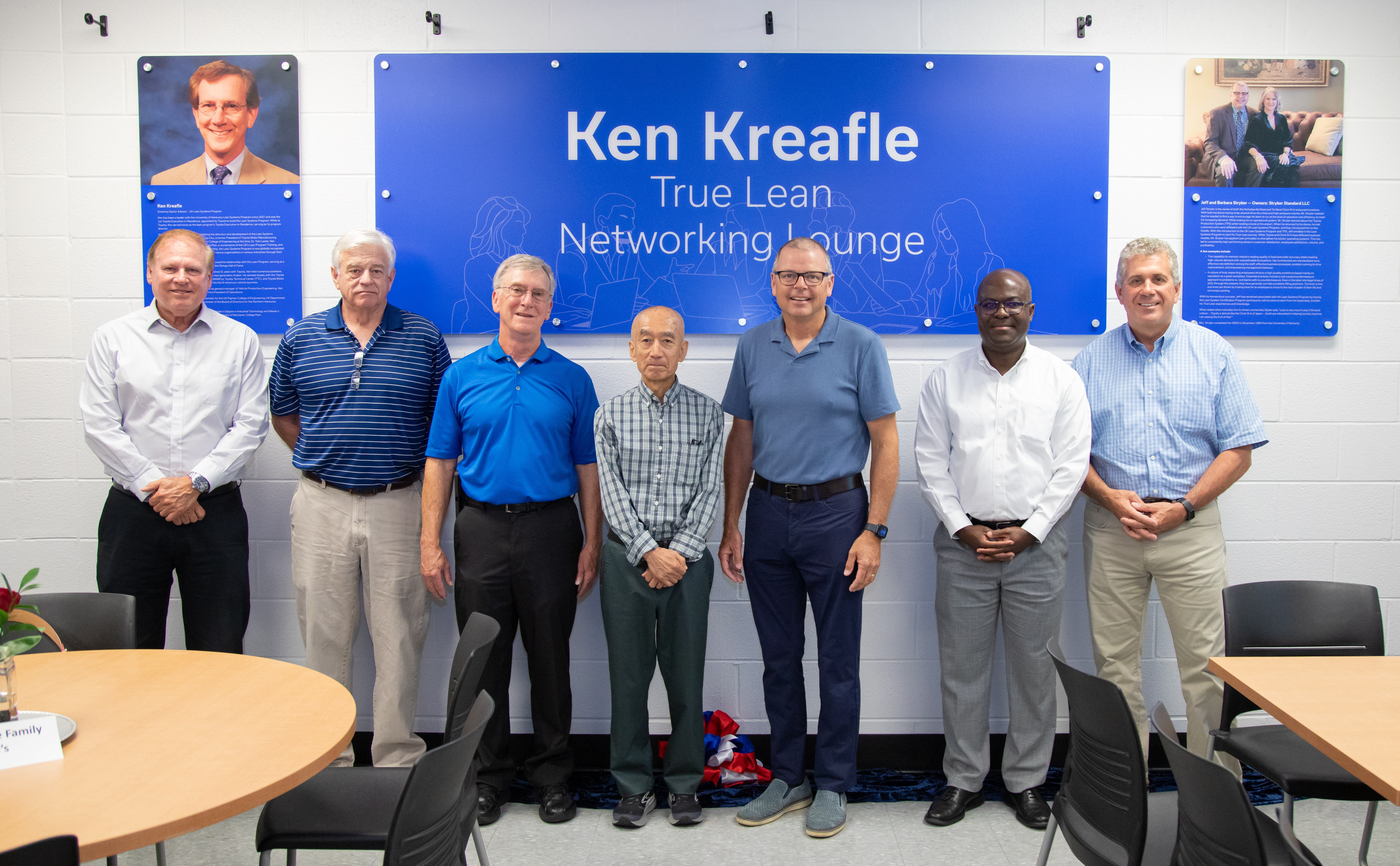 Dean Buchheit (left) with Lean Systems Program leadership and Jeff Stryker in front of dedication plaques