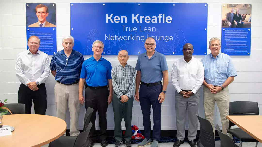 Dean Buchheit (left) with Lean Systems Program leadership and Jeff Stryker in front of dedication plaques